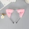 Pink plush fox ears headband with black nose bridge and dangling ears