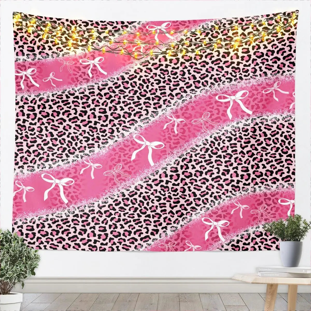 Pink and black leopard print tapestry wall hanging featuring a wild animal pattern.