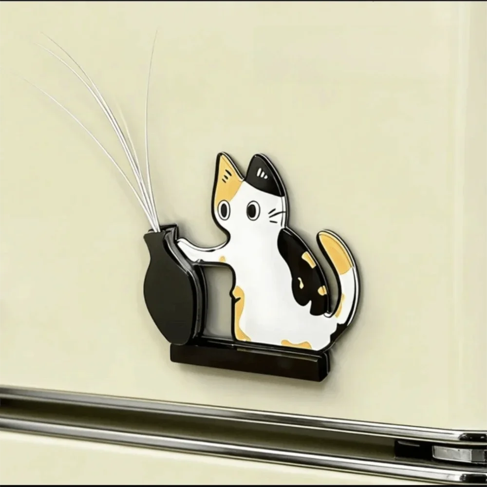 A black and white acrylic cat head decor featuring long, silver whiskers mounted on a wall.