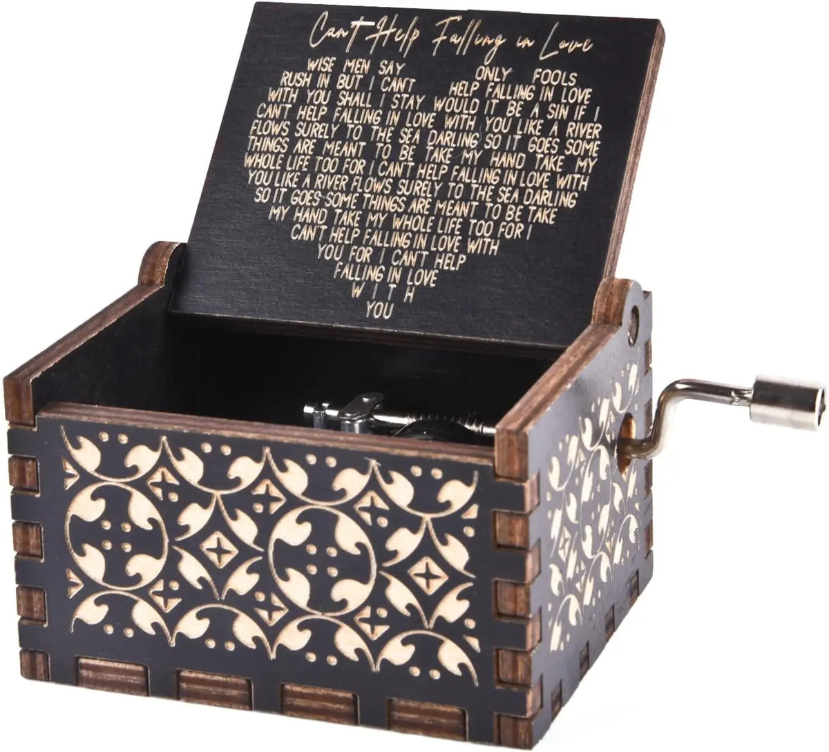 An antique engraved wooden music box with a lid showing text and a small metal key.