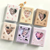 A set of pink and beige mini photo card album binders featuring K-pop idols and cute animal designs.