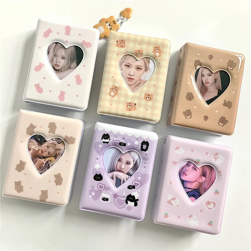 A set of pink and beige mini photo card album binders featuring K-pop idols and cute animal designs.