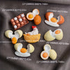 A collection of kawaii food-themed fridge magnets featuring various shapes and colors like eggs, donuts, and other food items