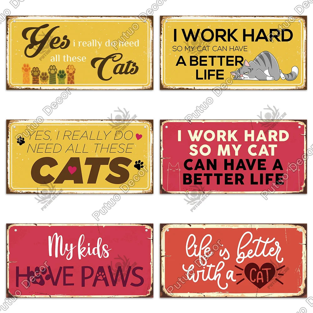 A collection of rustic wooden wall plaques featuring text about cats and hard work, including 'Yes I really need all these Ca