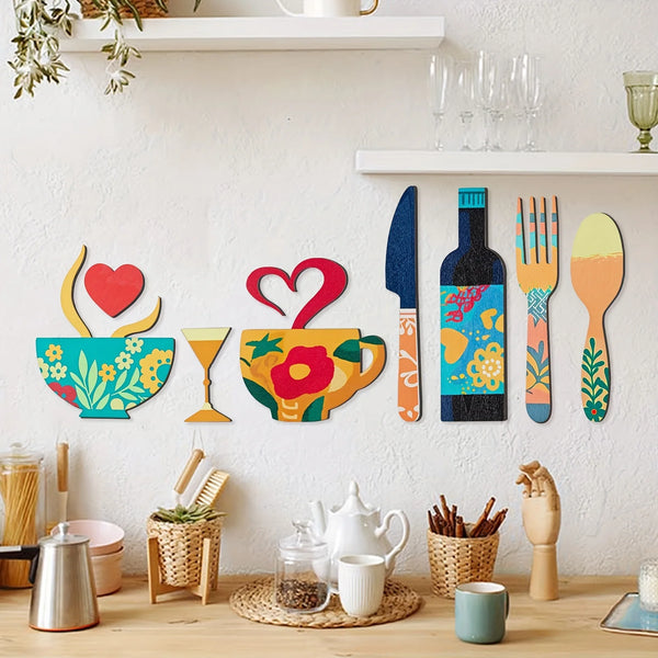 A set of seven rustic wooden wall decor pieces featuring a fork, cup, wine glass, and other kitchen items on a white shelf.