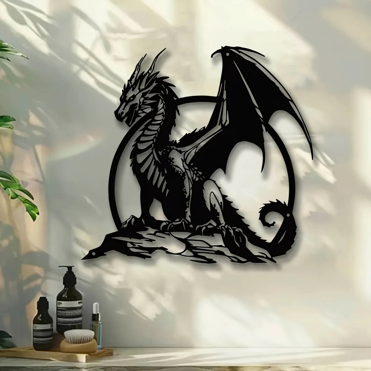 A black metal wall sculpture of a dragon with large wings set against a light background.