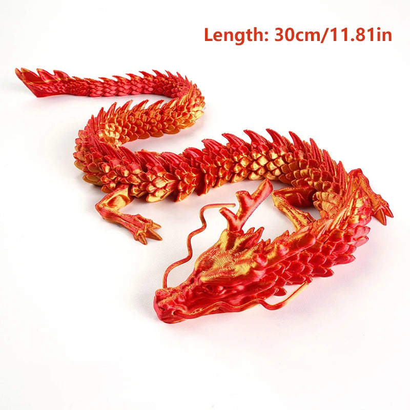 A red, flexible dragon figurine with detailed scales shown against a white background.