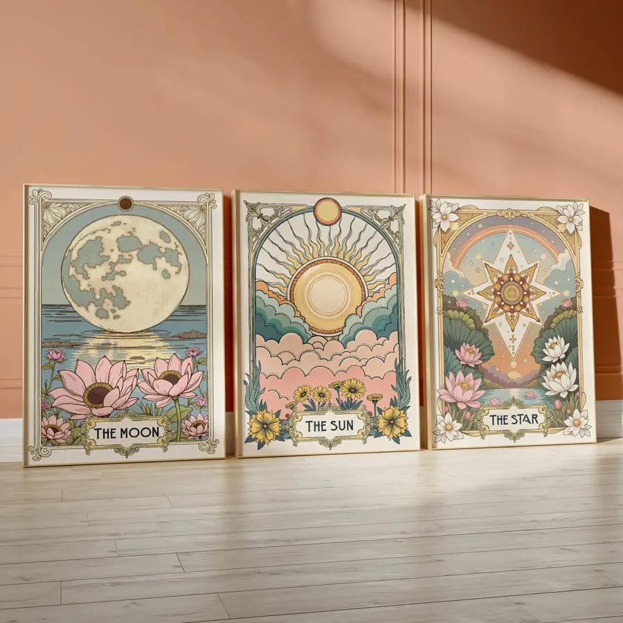 A set of three framed celestial tarot art prints featuring the moon sun and star with floral designs.