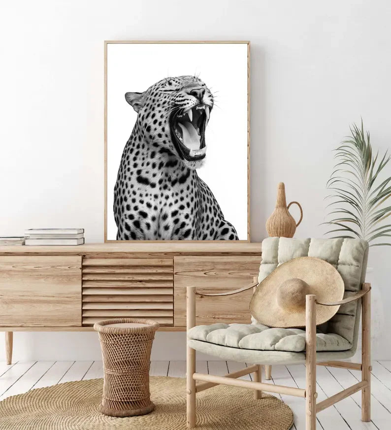 A close-up painting of a roaring leopard with black spots against a white background.
