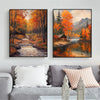 Canvas wall art featuring an autumn field landscape with vibrant orange and yellow foliage and a reflective water surface.
