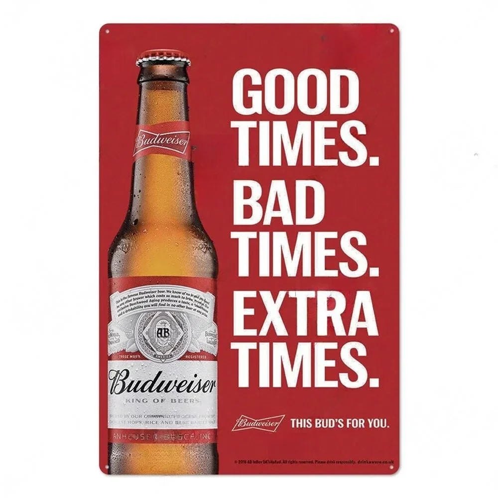 A red metal sign with white text that reads GOOD TIMES BAD TIMES EXTRA TIMES and features a Budweiser bottle.