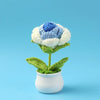 Hand woven crochet blue and white flower in a white pot