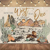 A rustic backdrop featuring a desert landscape with cacti and mountains for a Wild West cowboy birthday party.