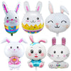 A collection of cartoon white bunny foil balloons in various styles and colors.