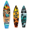 A set of three surfboard-shaped wooden wall decor signs featuring tropical scenes and text like Livin' the Dream