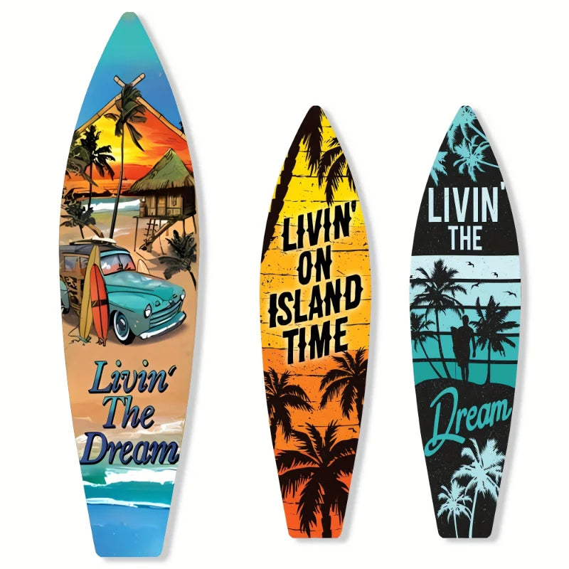 A set of three surfboard-shaped wooden wall decor signs featuring tropical scenes and text like Livin' the Dream