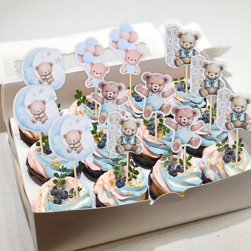 A box of cartoon bear cupcake toppers featuring various designs for baby shower and birthday parties.