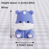 A cute purple rhino-shaped cake topper with a white snout and small paws.