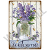 A vintage metal sign featuring a glass jar filled with purple lavender flowers and several bees, with the word welcome writte