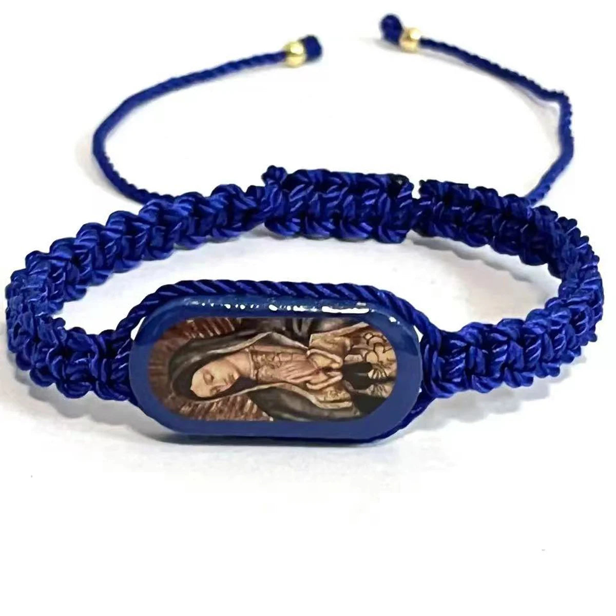 A dark blue braided prayer bracelet featuring a carved wooden image of the Virgin Mary.