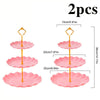 Two pink three-tier dessert racks with gold stands and pink plates shown side by side.