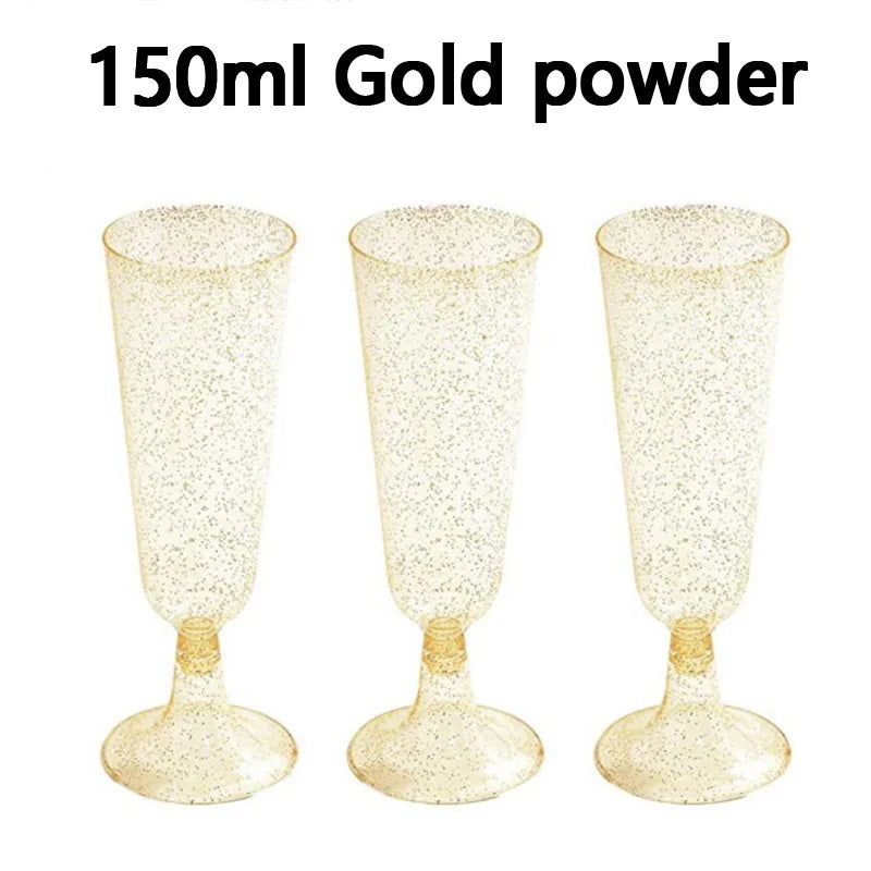 Three clear gold powder disposable champagne glasses displayed against a white background.