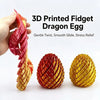 A hand holds a 3D printed dragon egg toy made of reddish-orange and gold material.