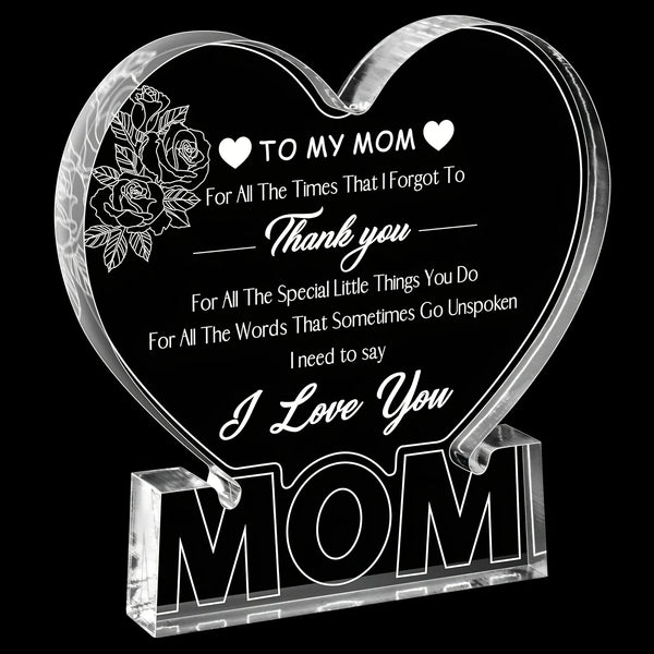 Plaque en acrylique transparent en forme de cœur gravée avec 'À ma maman Merci je t'aime Maman' et un dessin de rose.