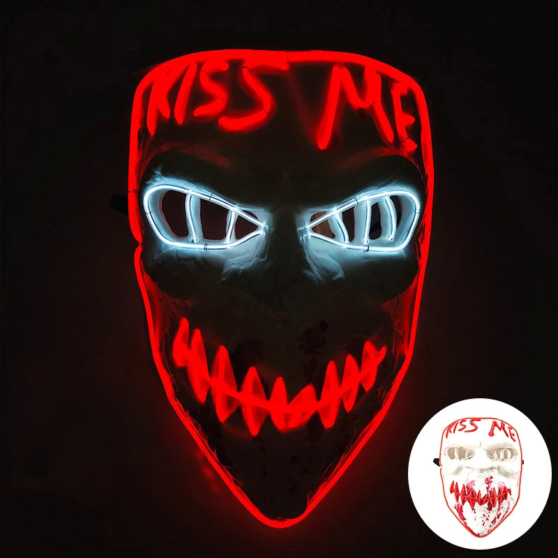 A glowing red mask with white text and bright blue eyes against a dark background.