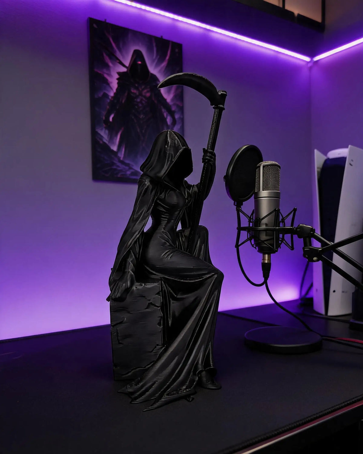 A black figurine of a gothic female grim reaper with a scythe is displayed under purple lighting.