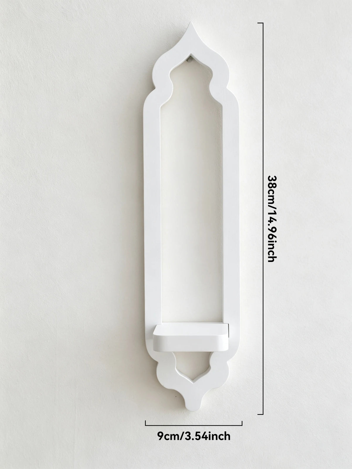 White wooden arch wall shelf with a decorative pointed top and a curved bottom mount.