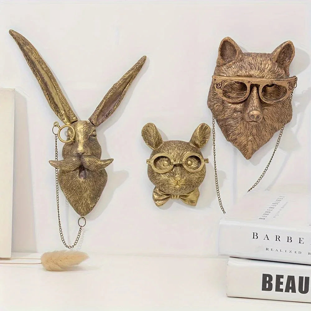 A brass deer head storage hook wall decor featuring a detailed, textured face and ears.