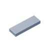 A rectangular building brick with a smooth finish, shown at an angle.