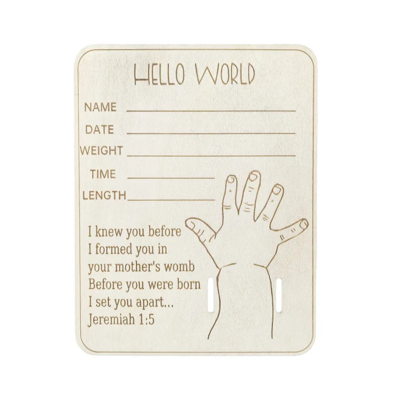 A light beige card with handwritten lines for name date weight time and length, featuring a hand outline and the text Hello W