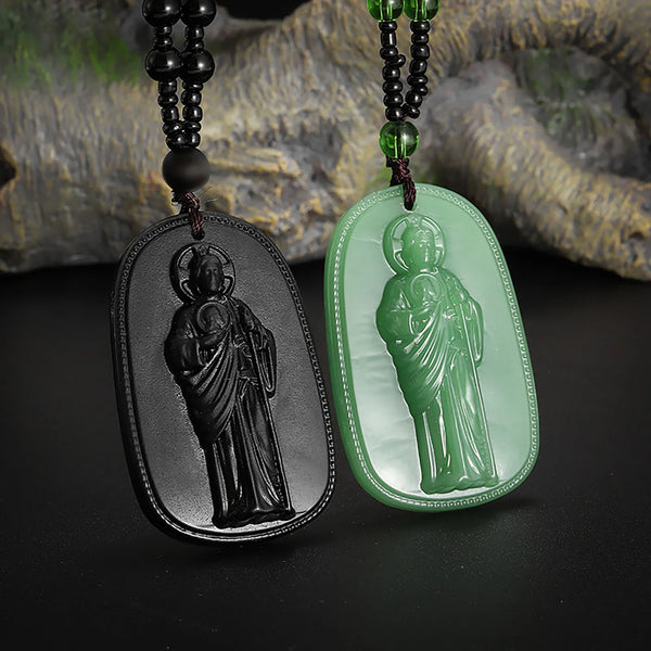 Obsidian pendant necklace featuring a carved figure of Saint Jude Thaddeus in a smooth green stone.