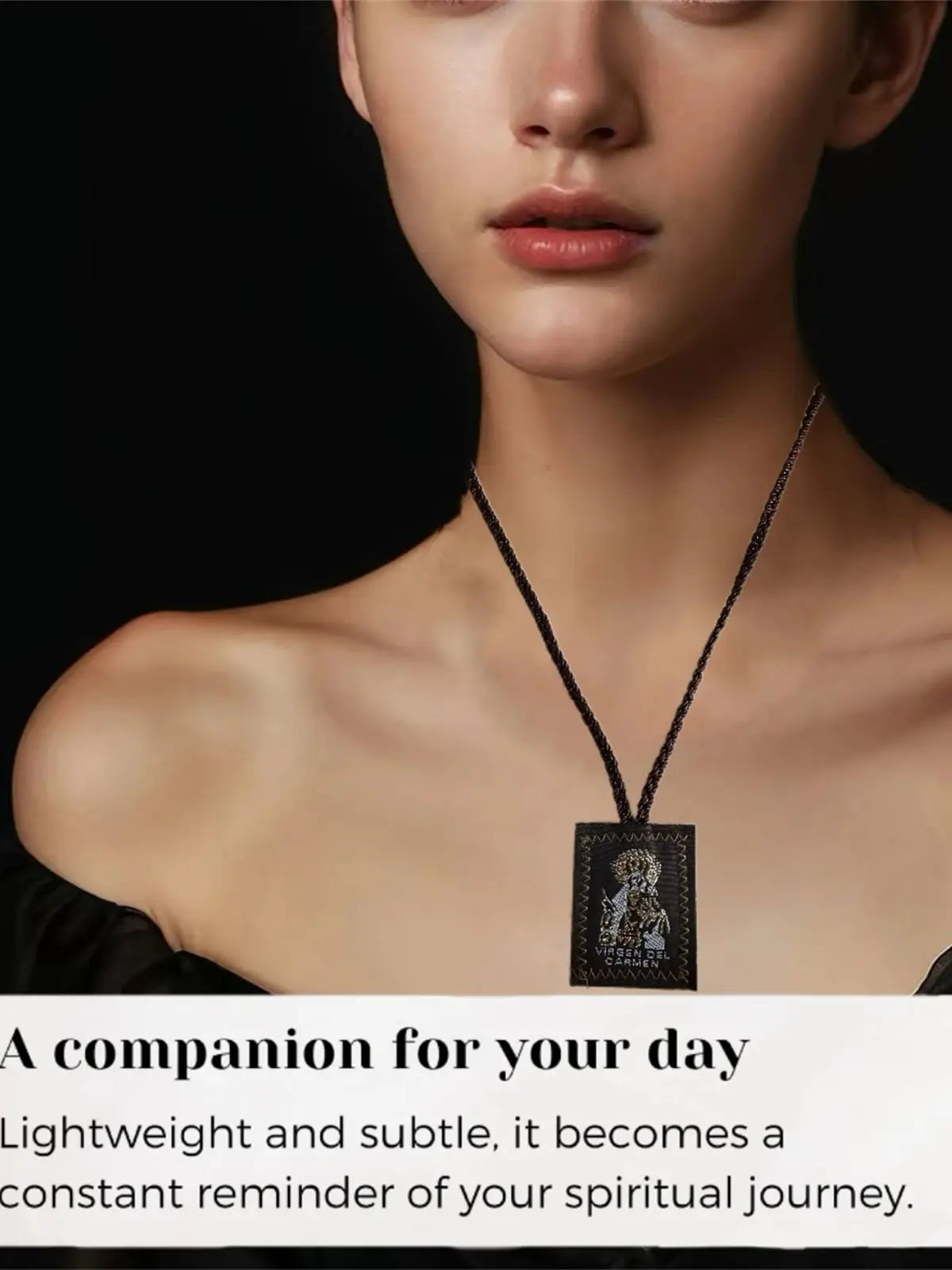 A close-up of a woman wearing a black multi-symbol Catholic pendant necklace on her neck.