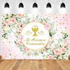 A floral and gold themed backdrop featuring pink roses and greenery for a baptism or communion celebration.