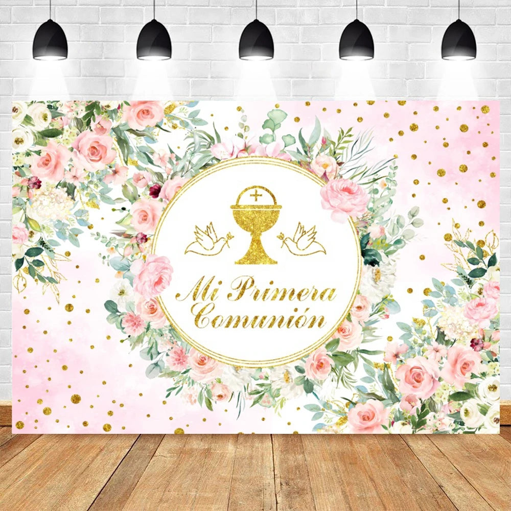 A floral and gold themed backdrop featuring pink roses and greenery for a baptism or communion celebration.