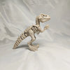 A 3D printed figurine of a dinosaur skeleton, featuring a T-Rex and Mosasaurus collectible.