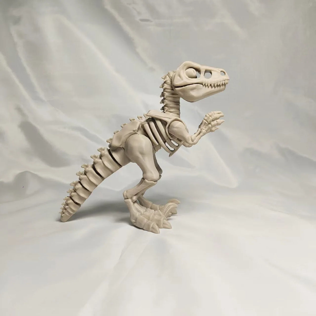 A 3D printed figurine of a dinosaur skeleton, featuring a T-Rex and Mosasaurus collectible.