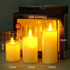 A box of LED candles showing three glass candles with flickering yellow flames.