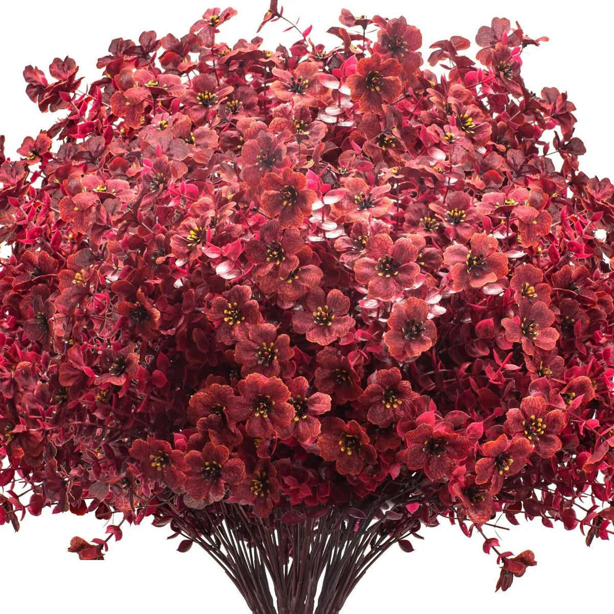 A dense cluster of realistic artificial silk flowers in deep reddish-maroon tones.