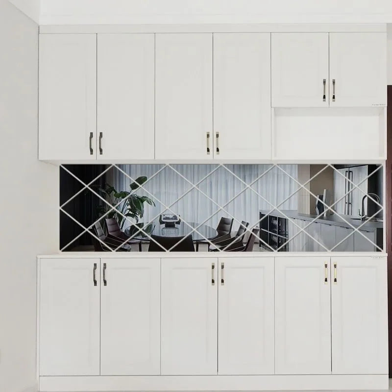 White kitchen cabinets with a diamond-patterned glass display and white drawers.