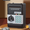 A black password saving piggy bank with a digital display and a rotary dial is shown on a wooden surface.