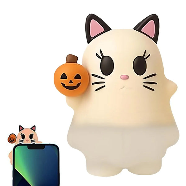 A white cat-shaped ghost phone decoration charm with black ears and a carved pumpkin detail.