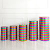 A row of colorful spandex cylinder stands with horizontal stripes in various bright colors on a white floor.
