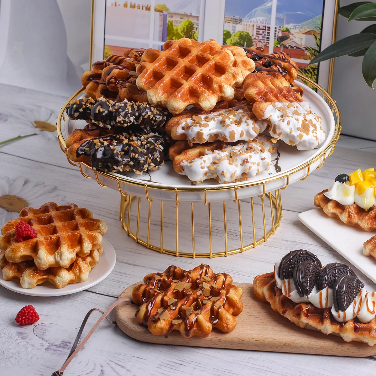 A golden wire stand holds various waffle foods including Belgian waffles, sweet waffles, and waffle slices.
