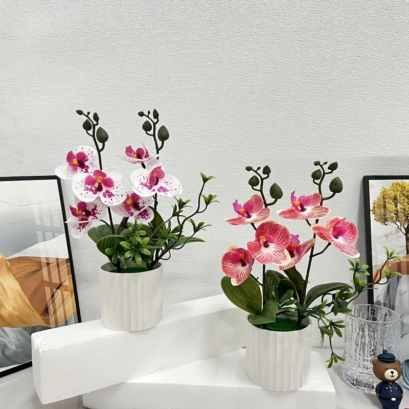 Artificial pink and white phalaenopsis orchids in potted white containers for home decor