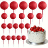 A set of twenty glossy red mini foam ball cake toppers on sticks for party decoration
