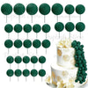 A set of green foam cake toppers on sticks, including round and leaf shapes.